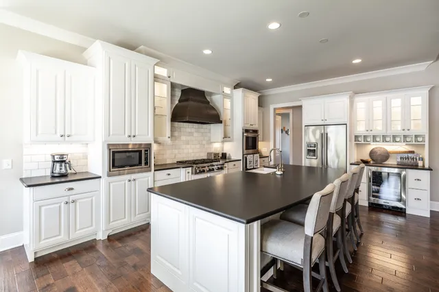 a bedroom with a bed and a fireplace