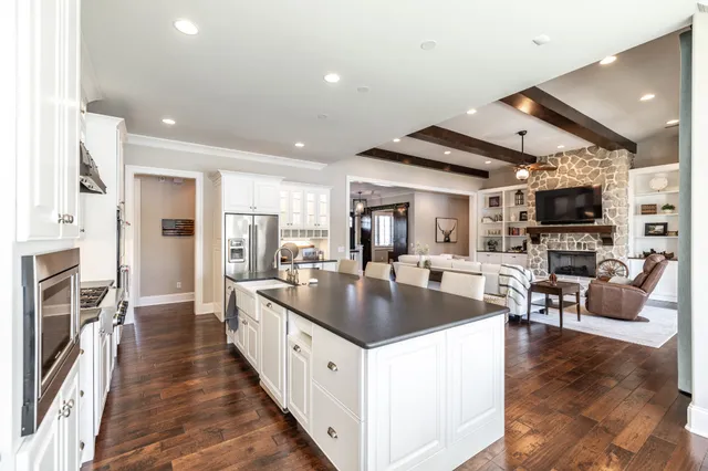 a spacious bathroom with a double vanity sink mirror double and shower