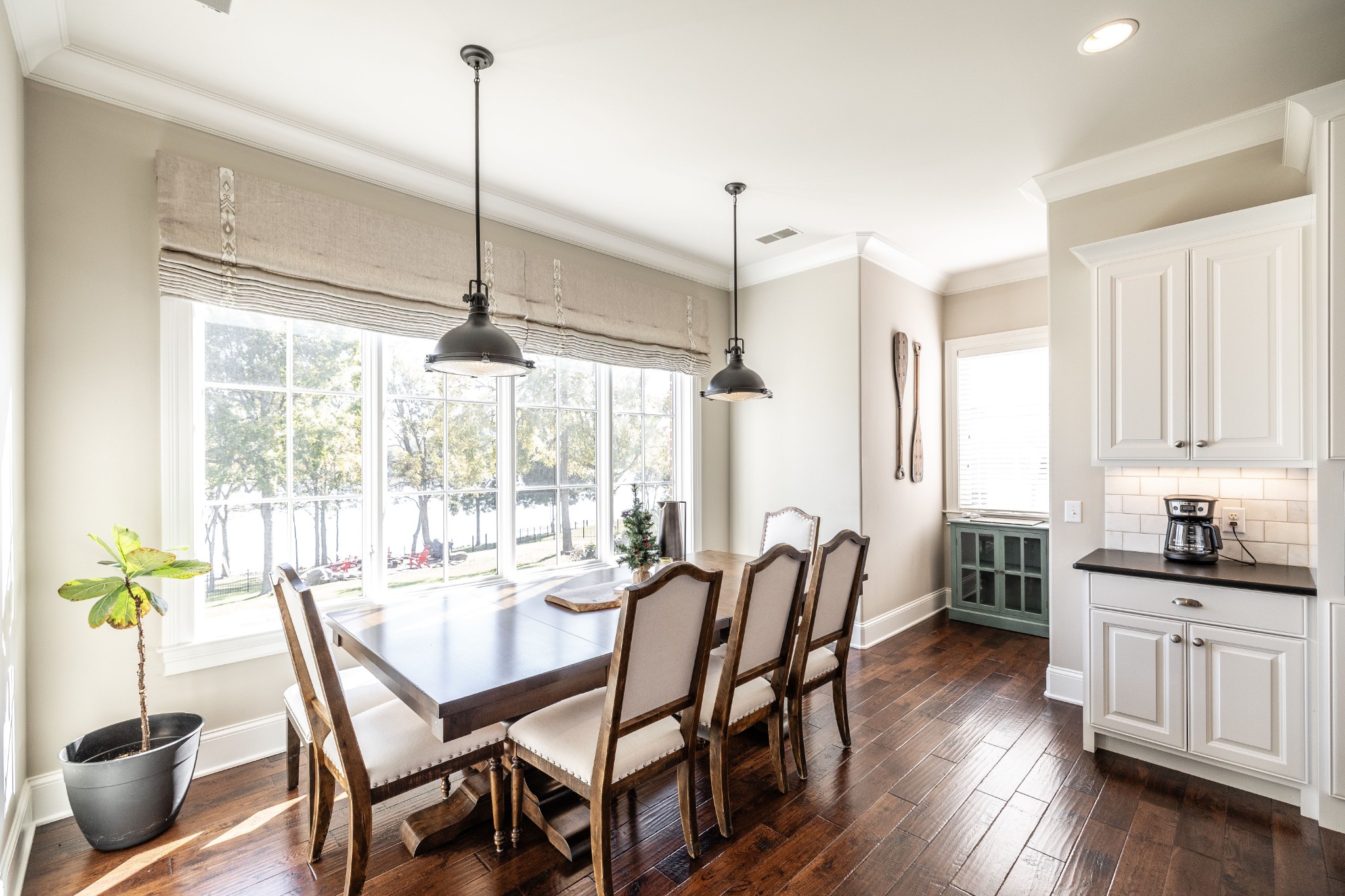 1395 Rozella Way Gallatin, TN 37066 - Photo 21 of 81 a dining room with furniture a chandelier and wooden floor