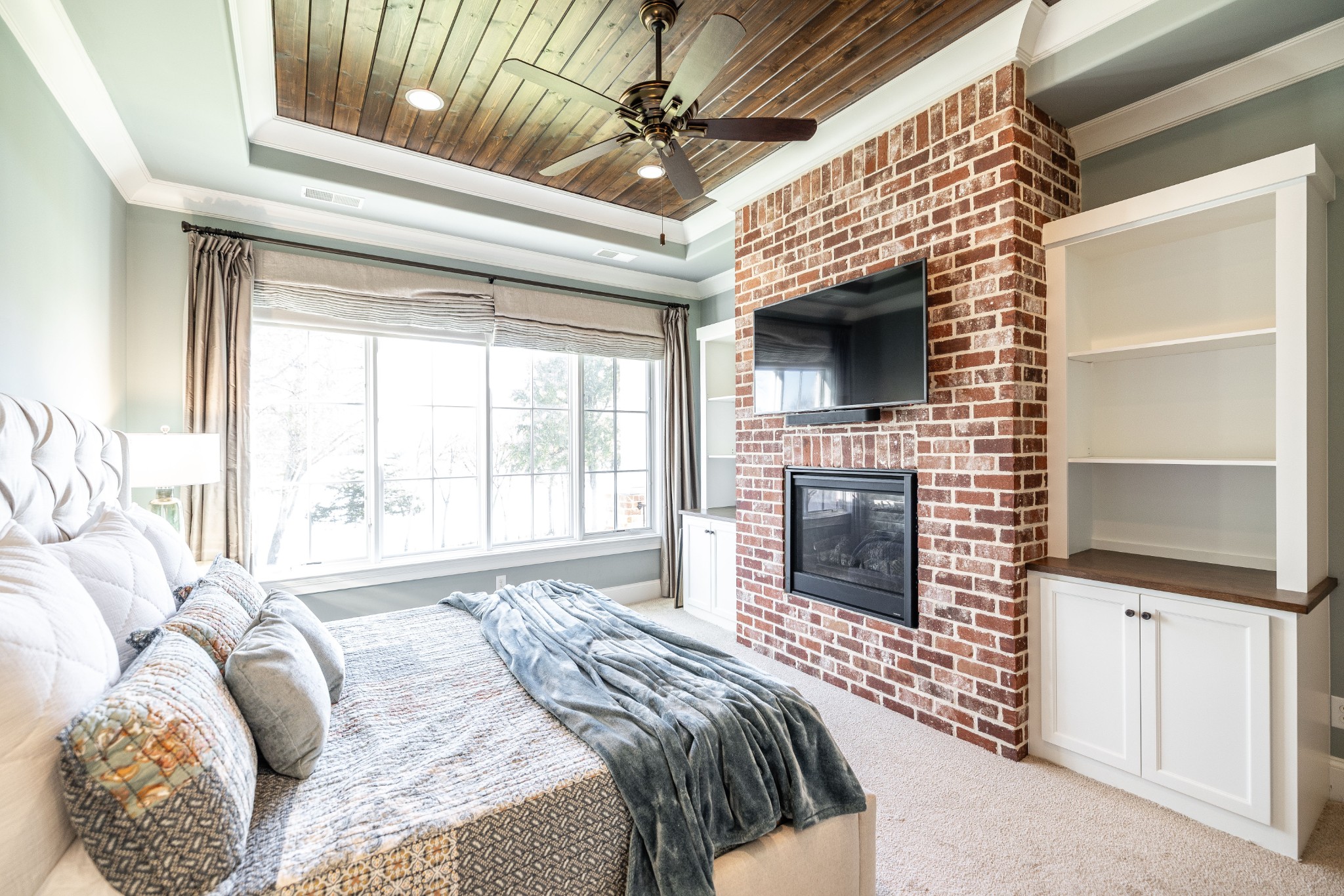1395 Rozella Way Gallatin, TN 37066 - Photo 26 of 81 a bedroom with a bed and a fireplace