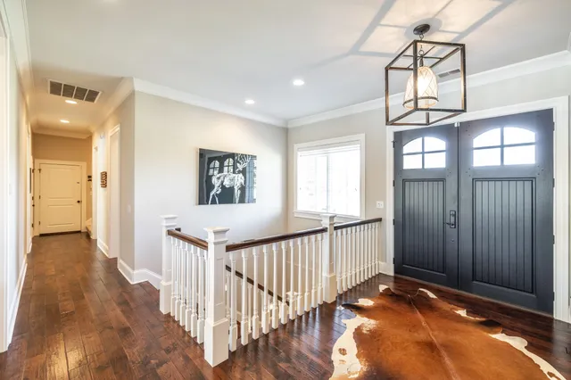 a view of a dining room with furniture and a window