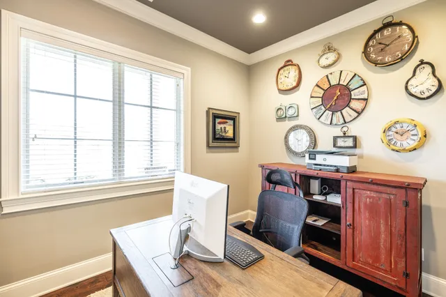 a living room with fireplace furniture and a flat screen tv