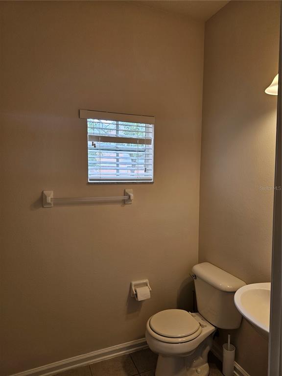 26638 Castleview Way Wesley Chapel, FL 33544 - Photo 17 of 24 a white toilet sitting next to a white wall