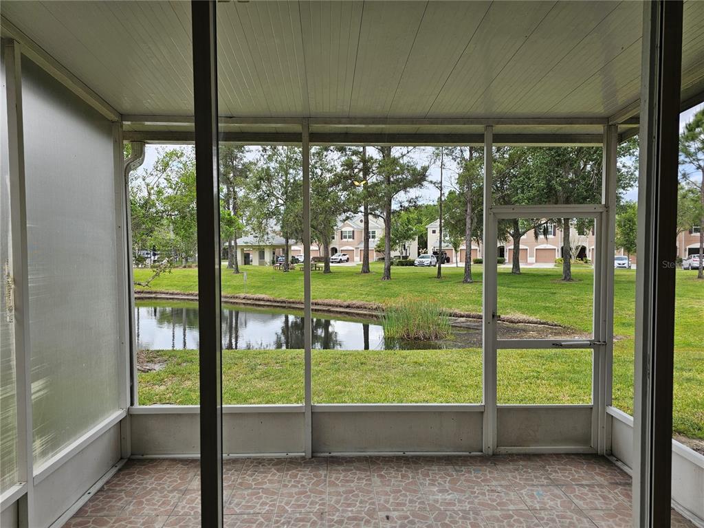 26638 Castleview Way Wesley Chapel, FL 33544 - Photo 19 of 24 a view of a porch and garden