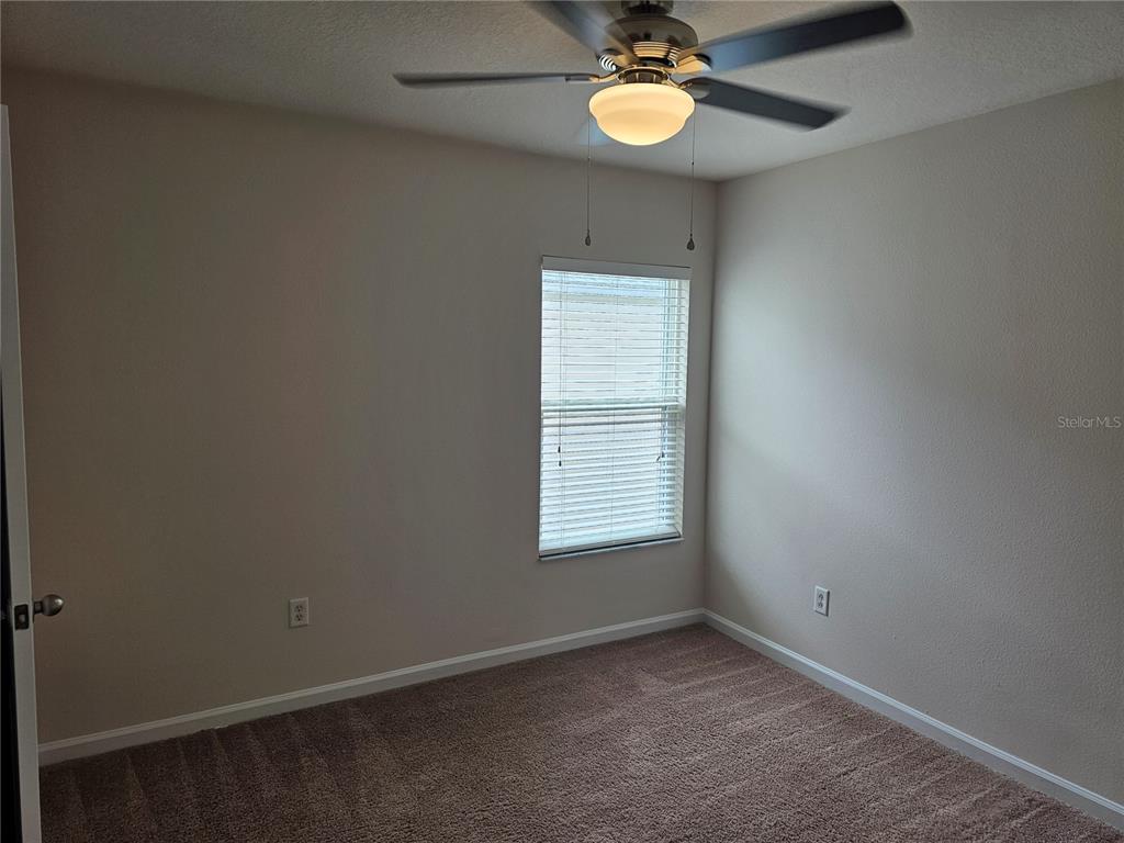 26638 Castleview Way Wesley Chapel, FL 33544 - Photo 9 of 24 an empty room with a window
