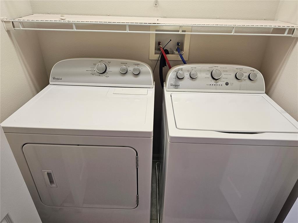 26638 Castleview Way Wesley Chapel, FL 33544 - Photo 10 of 24 a utility room with dryer and washer