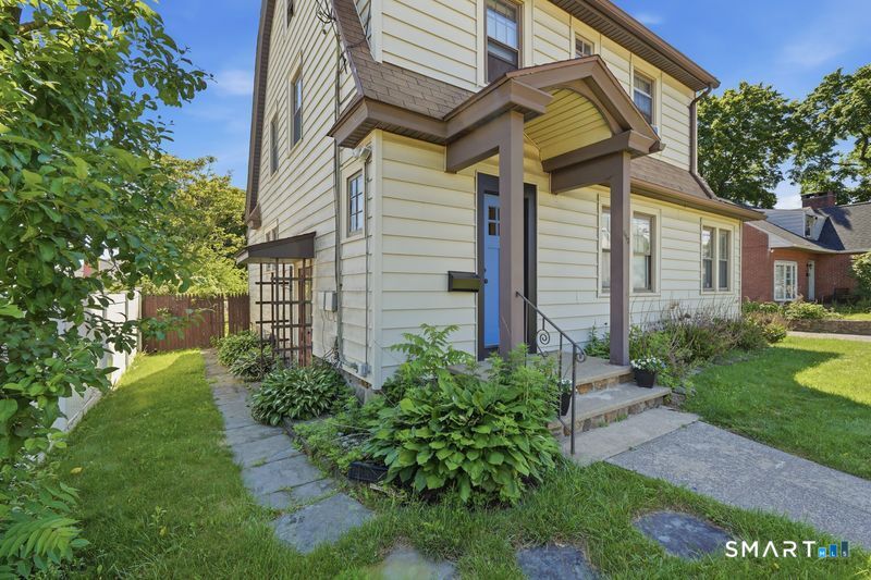 443 Highland Avenue Waterbury, CT 06708 - Photo 2 of 24 a front view of a house with garden