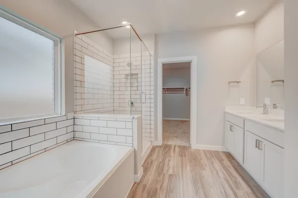 a bathroom with a bathtub and a sink