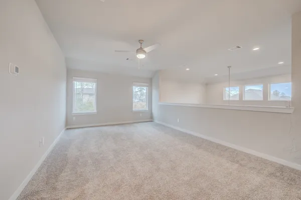 an empty room with windows and entrance