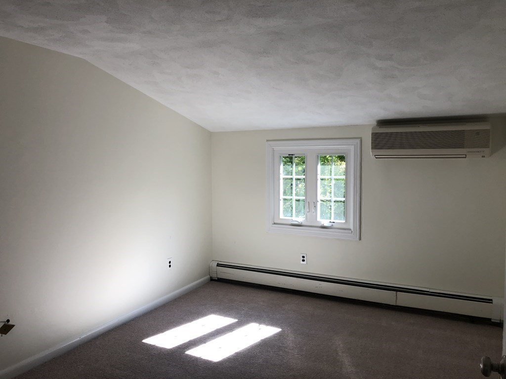 24 State Street, Unit 2 Wellesley, MA 02482 - Photo 11 of 21 an empty room with a window