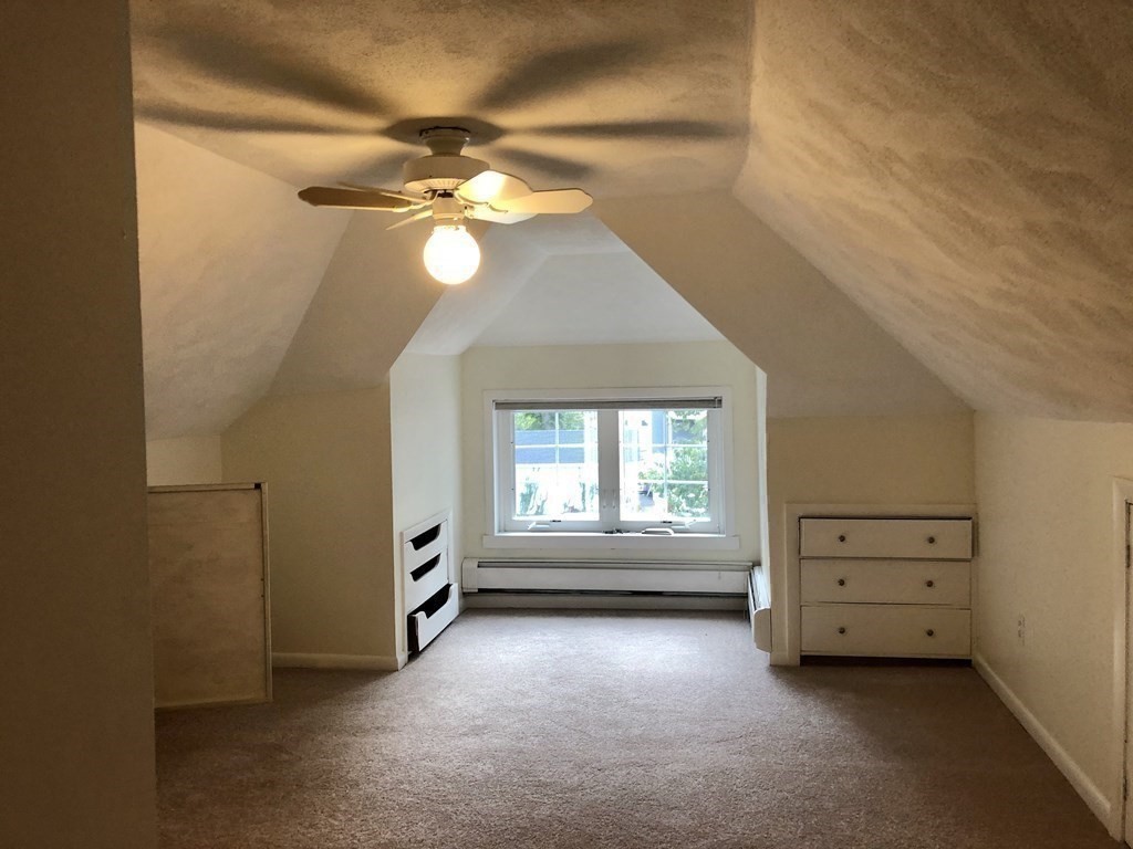 24 State Street, Unit 2 Wellesley, MA 02482 - Photo 14 of 21 a view of an empty room with a window