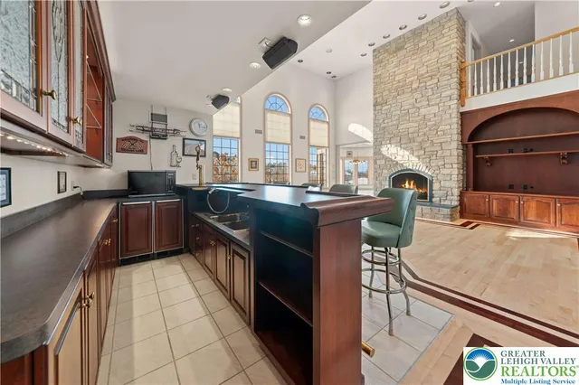 a kitchen with stainless steel appliances granite countertop a sink and a stove