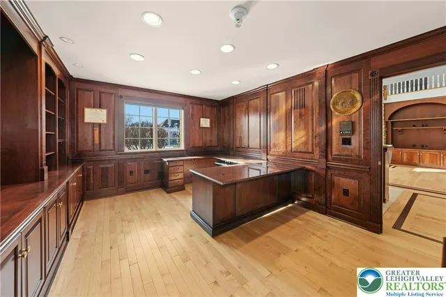 a kitchen with granite countertop a sink and wooden cabinets