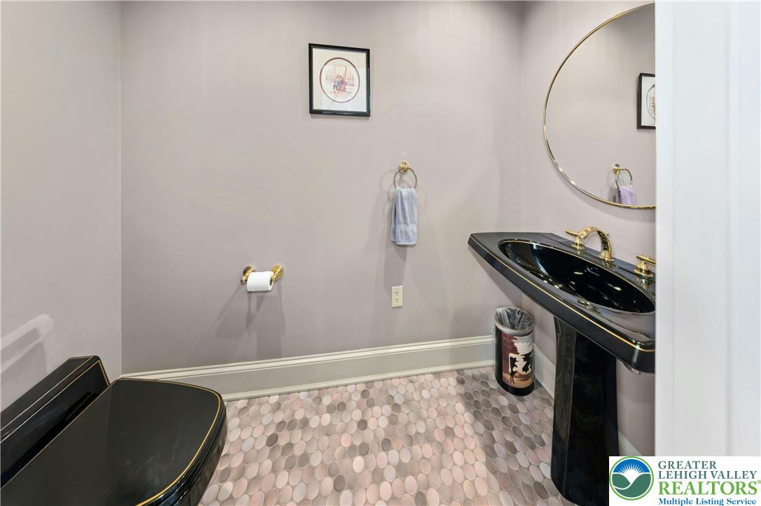 3640 Manor Road Bethlehem, PA 18020 - Photo 16 of 36 a bathroom with a sink and a mirror