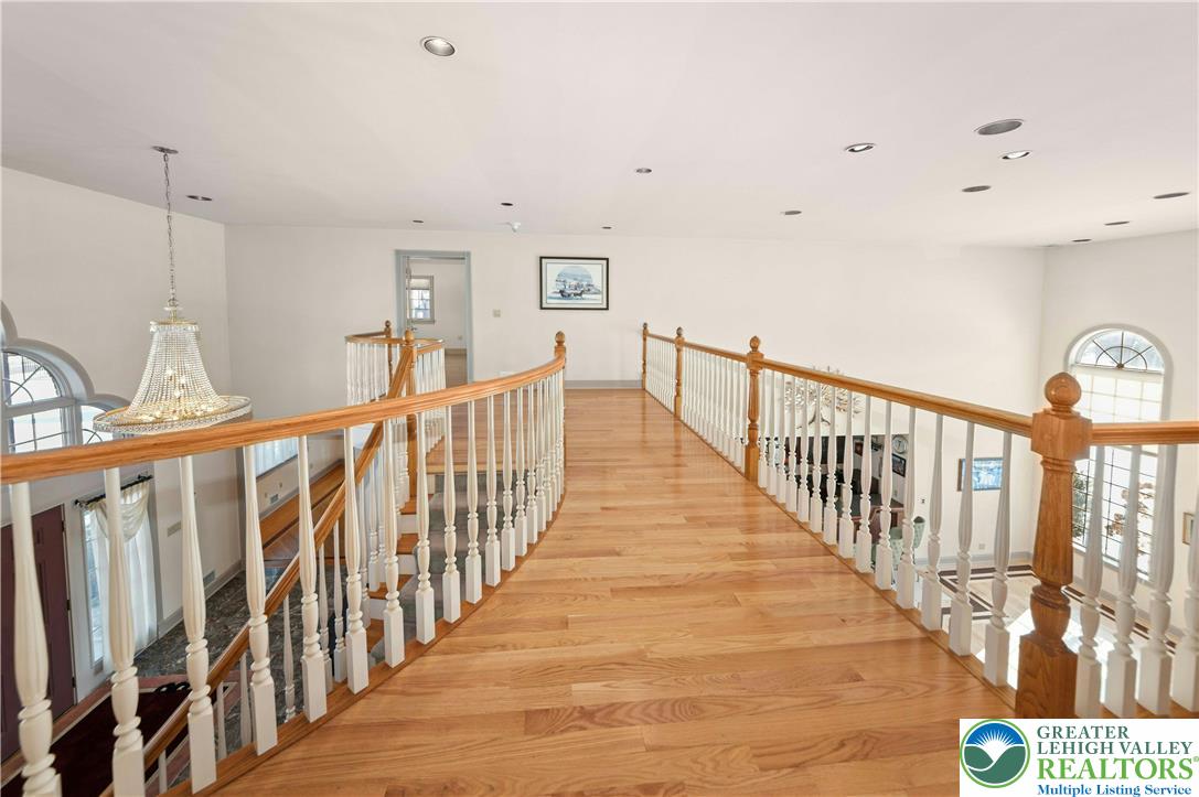 3640 Manor Road Bethlehem, PA 18020 - Photo 22 of 36 a view of staircase with lots of frames on wall and a window