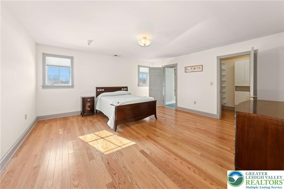 3640 Manor Road Bethlehem, PA 18020 - Photo 29 of 36 a spacious bedroom with a bed and wooden floor