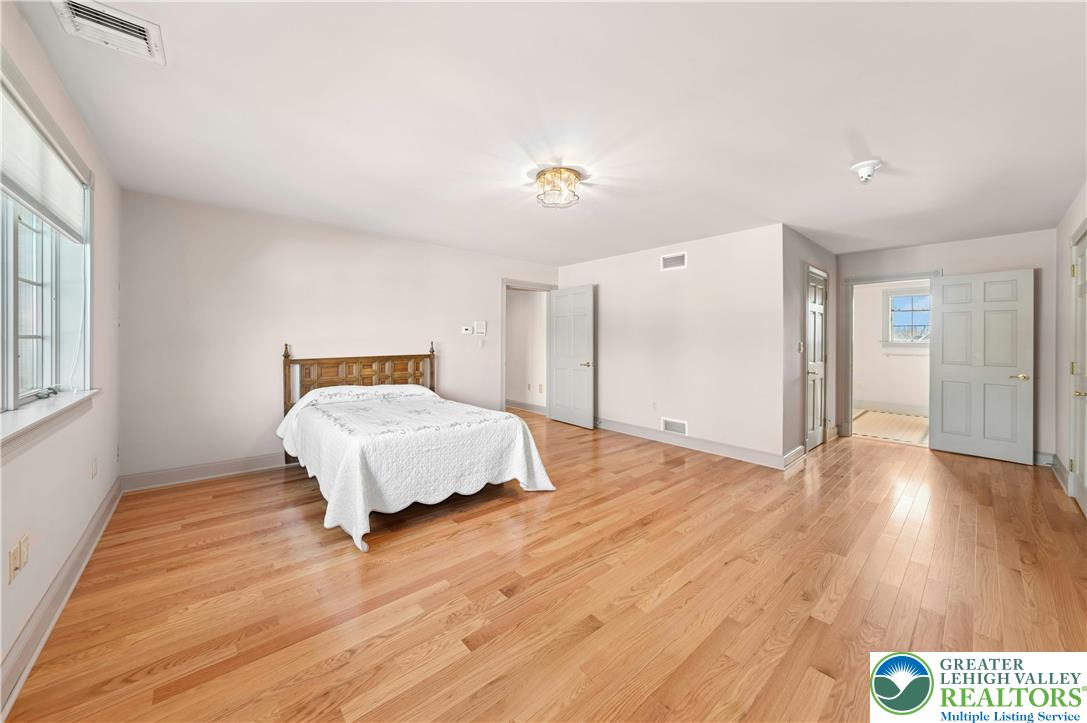 3640 Manor Road Bethlehem, PA 18020 - Photo 37 of 46 a bedroom with a bed and wooden floor