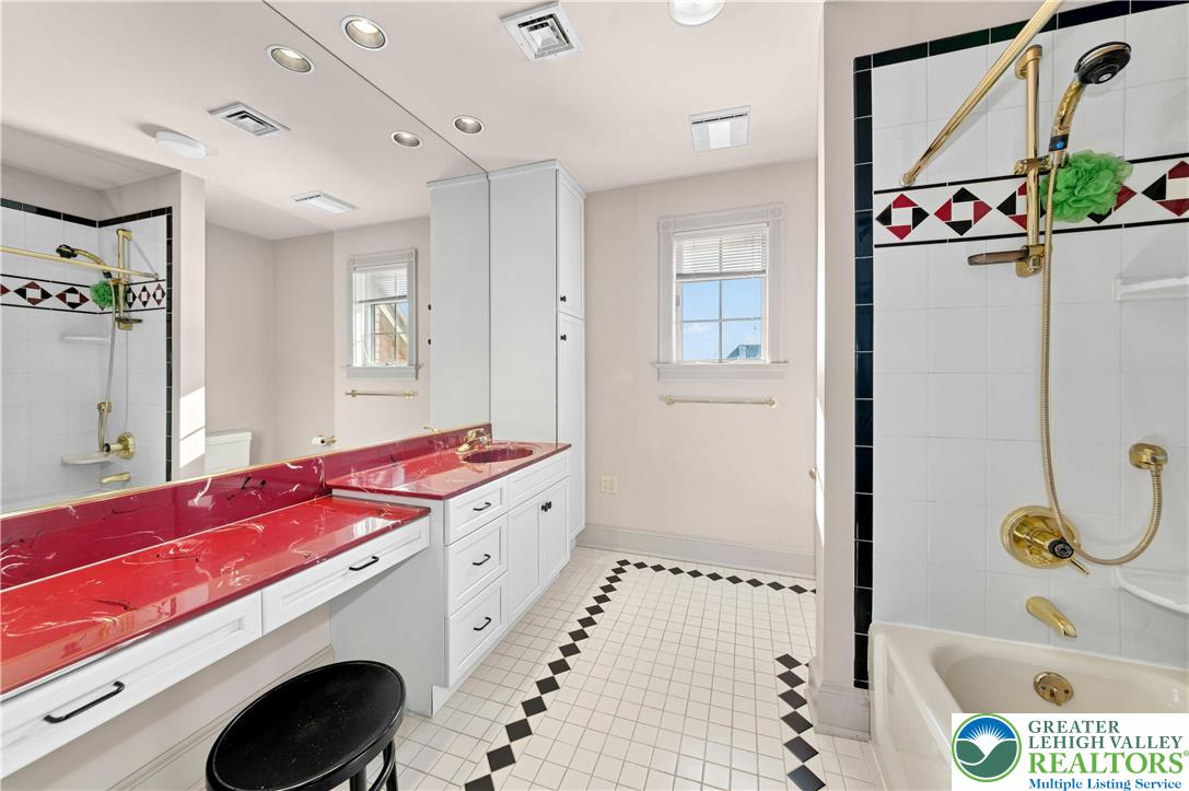 3640 Manor Road Bethlehem, PA 18020 - Photo 38 of 46 a bathroom with a tub sink and mirror