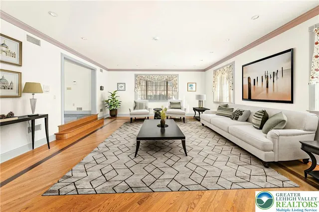 a living room with furniture and a rug