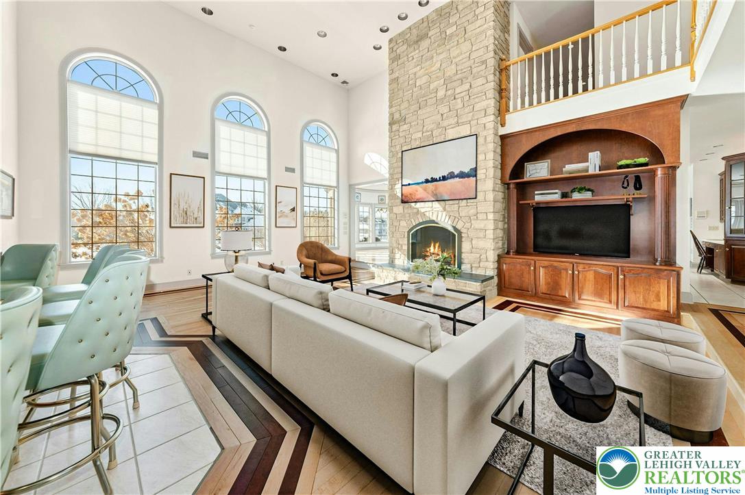 3640 Manor Road Bethlehem, PA 18020 - Photo 8 of 36 a living room with furniture a fireplace and flat screen tv