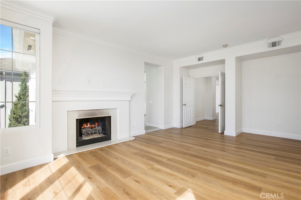 68 Bridgeport Road Newport Coast, CA 92657 - Photo 13 of 27 a bedroom with a bed and a fireplace