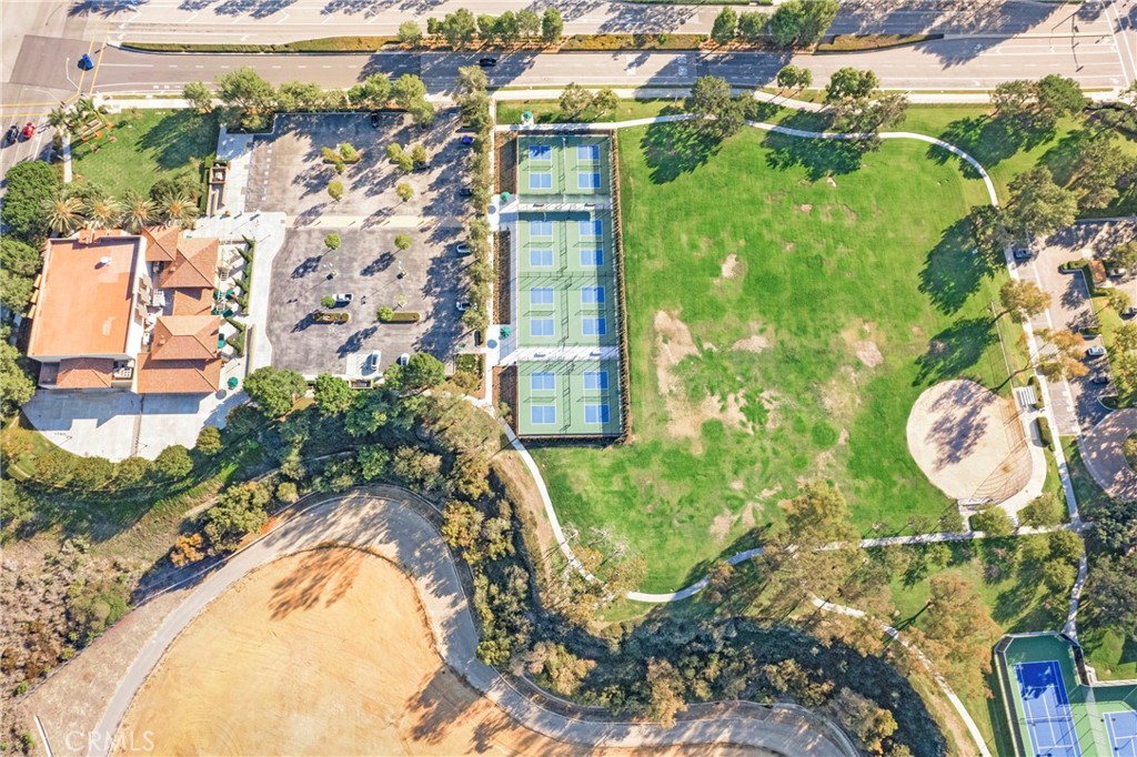 68 Bridgeport Road Newport Coast, CA 92657 - Photo 26 of 27 a view of a swimming pool with a yard and plants