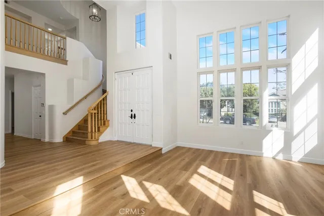 a view of an entryway with wooden floor
