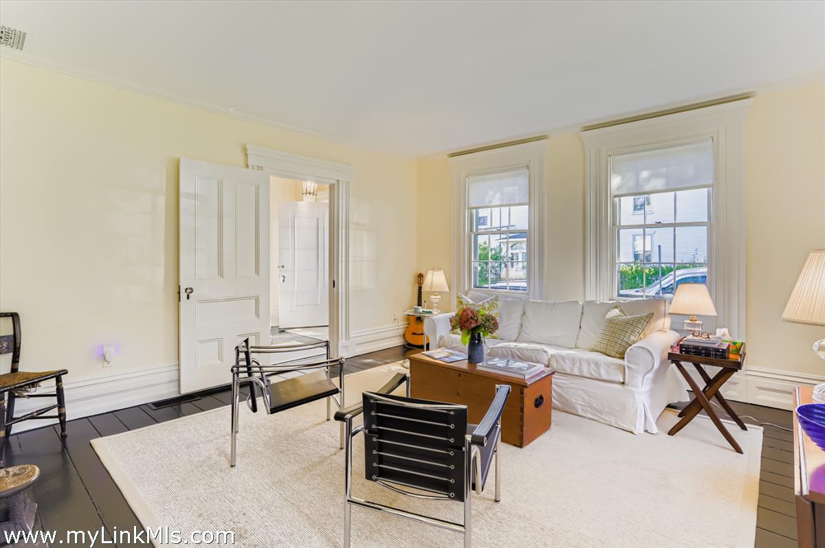 27 Spring Street Vineyard Haven, MA 02568 - Photo 27 of 58 a living room with furniture and wooden floor