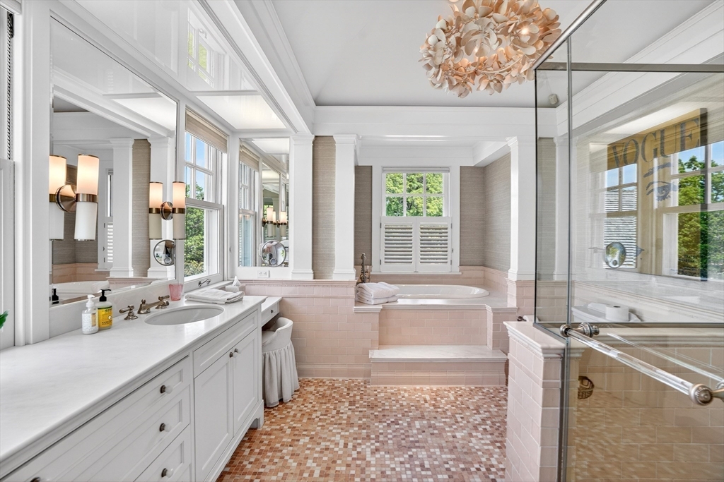 10-12 Boldwater Road Edgartown, MA 02539 - Photo 23 of 41 a spacious bathroom with a tub sink and mirror
