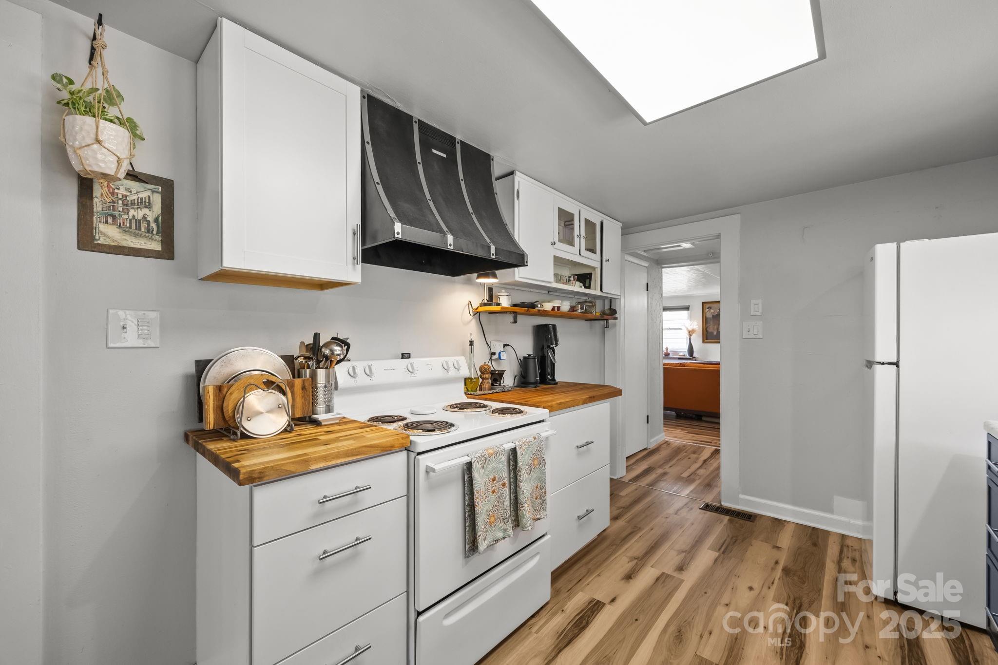 731 Don Felmet Road Marshall, NC 28753 - Photo 11 of 23 a kitchen that has a lot of cabinets in it