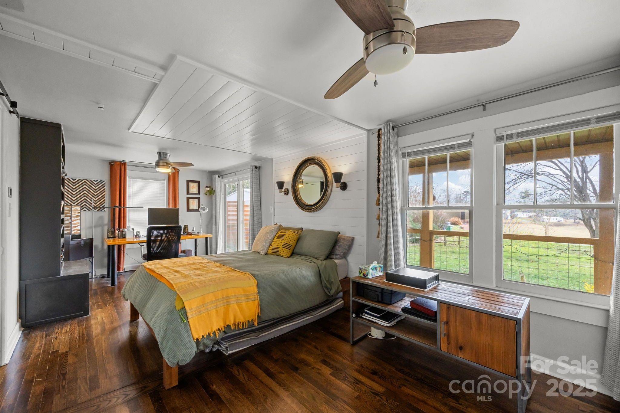 731 Don Felmet Road Marshall, NC 28753 - Photo 13 of 23 a bedroom with a bed and a large window