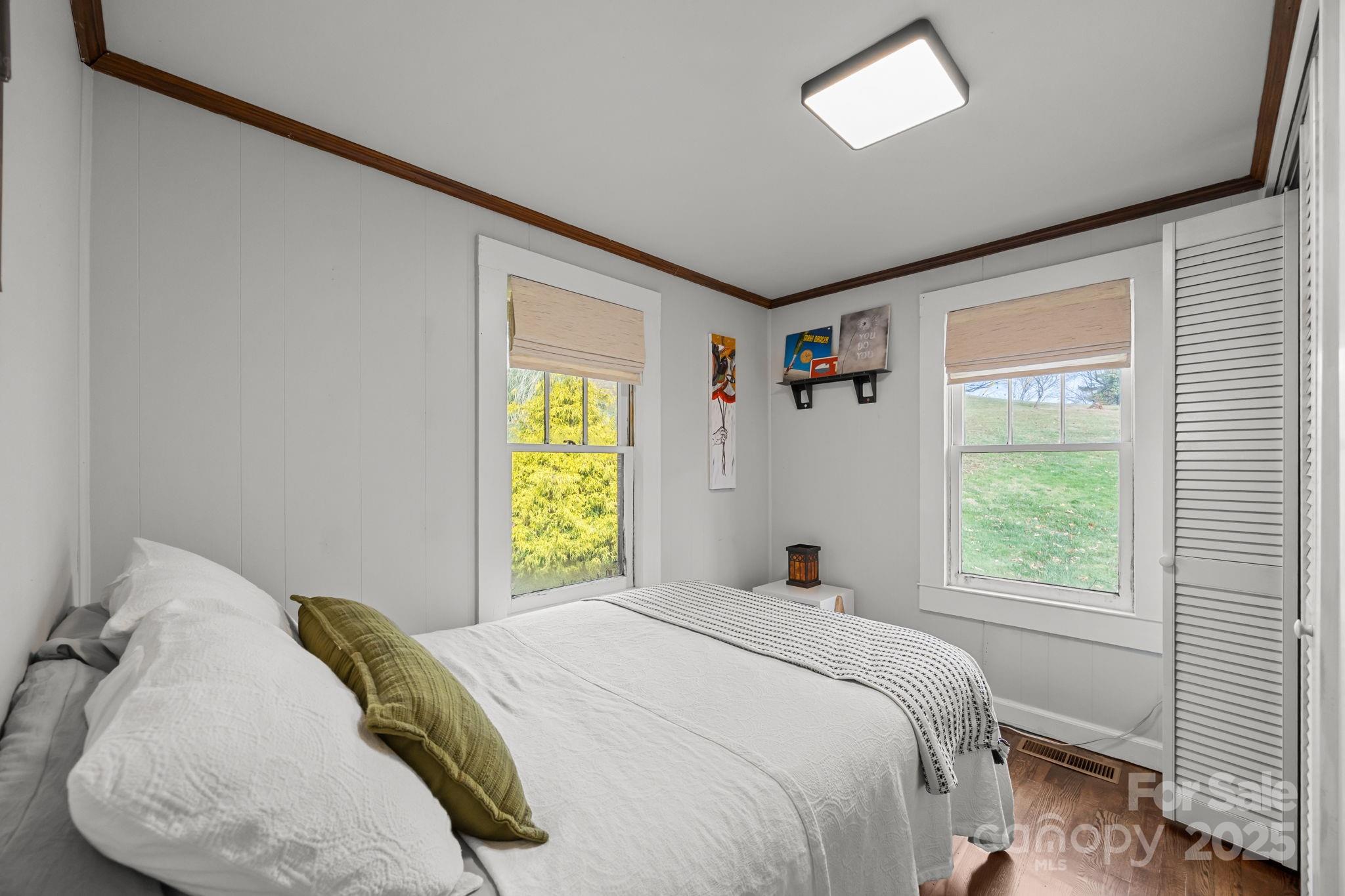 731 Don Felmet Road Marshall, NC 28753 - Photo 16 of 23 a bedroom with a bed and a window