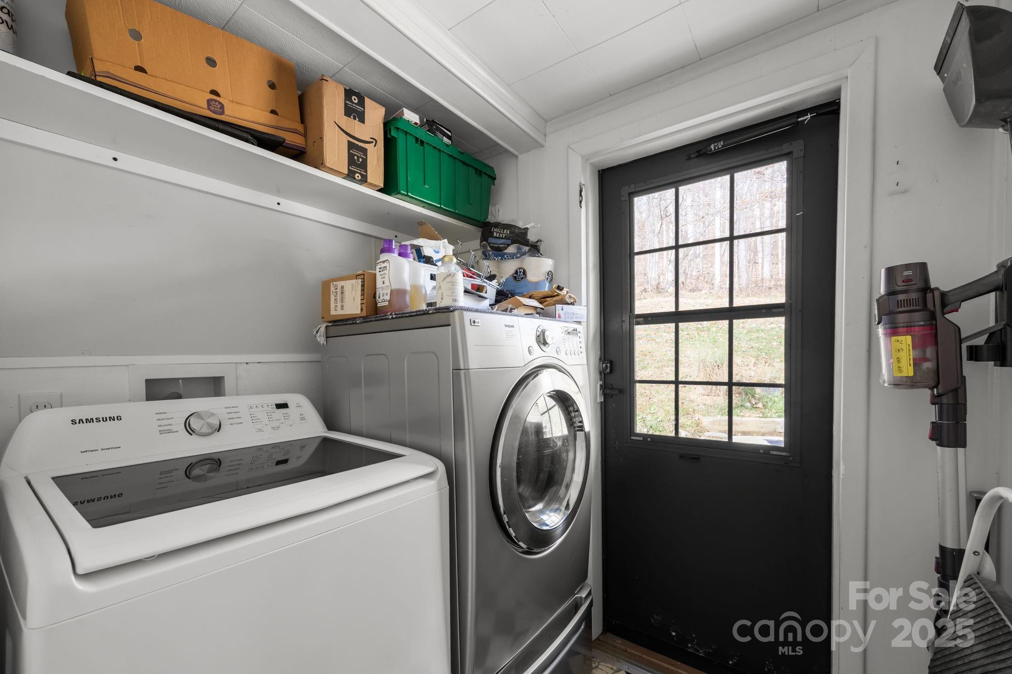 731 Don Felmet Road Marshall, NC 28753 - Photo 17 of 23 a utility room with dryer and washer