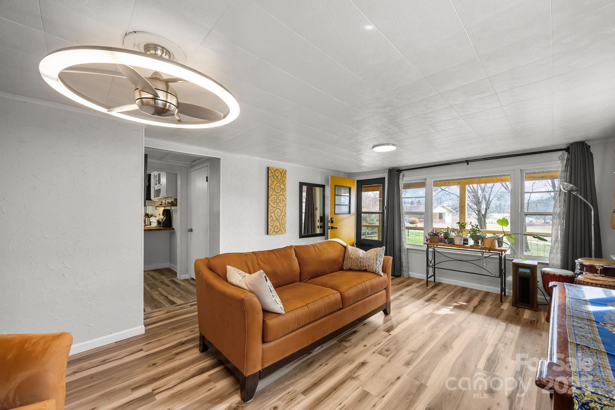731 Don Felmet Road Marshall, NC 28753 - Photo 2 of 23 a living room with furniture and a large window