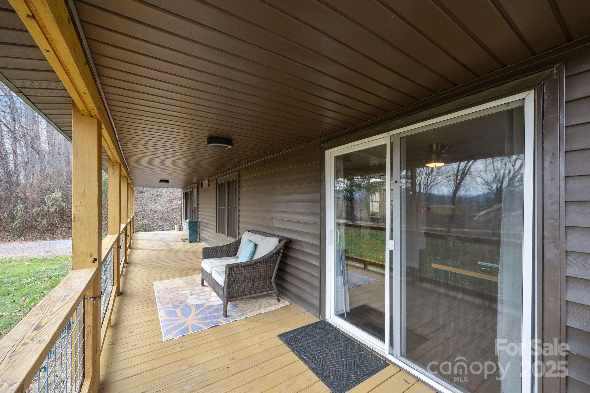 731 Don Felmet Road Marshall, NC 28753 - Photo 22 of 23 a porch with seating space and rug