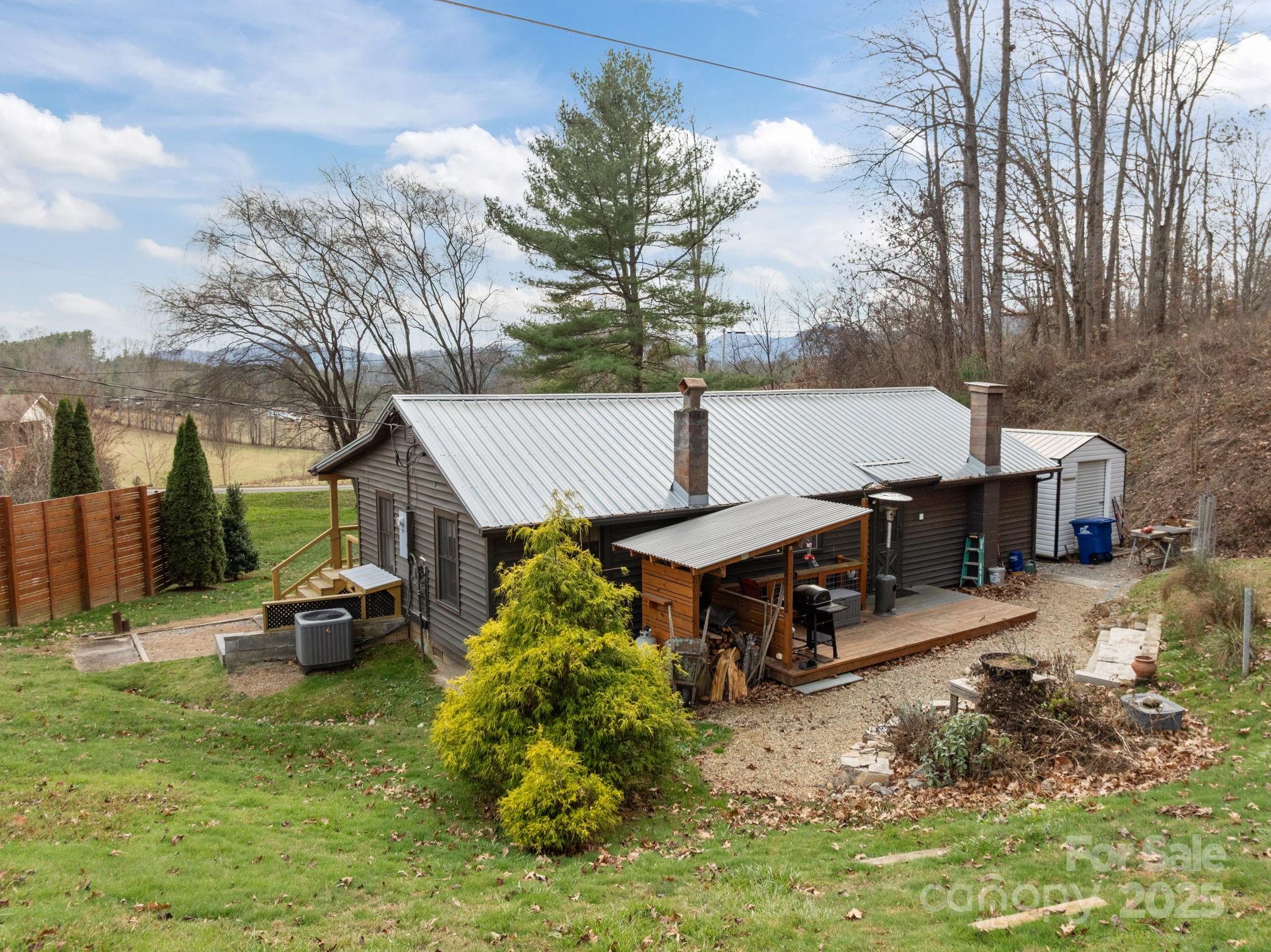 731 Don Felmet Road Marshall, NC 28753 - Photo 5 of 23 a view of a house with a chairs and table in the patio