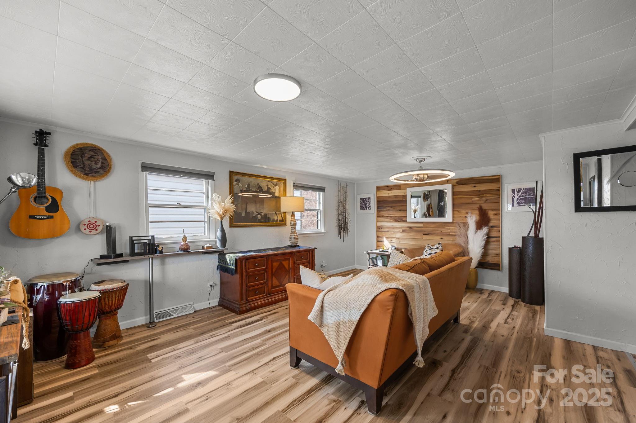 731 Don Felmet Road Marshall, NC 28753 - Photo 7 of 23 a living room with furniture and a wooden floor