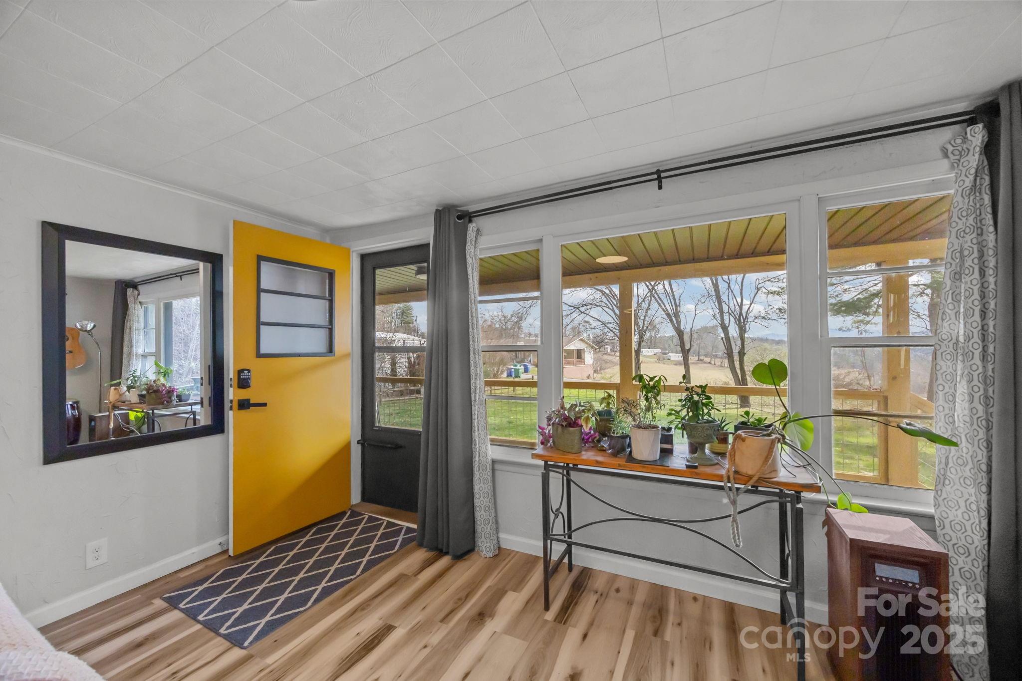 731 Don Felmet Road Marshall, NC 28753 - Photo 9 of 23 a room with wooden floor and furniture