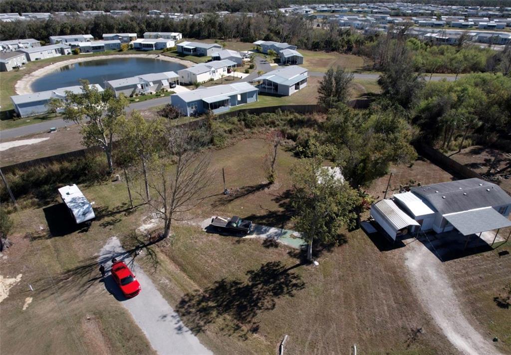 an aerial view of multiple houses with yard