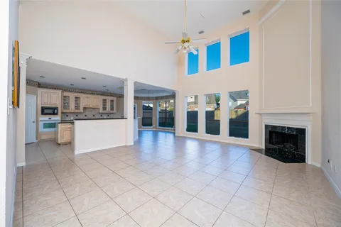a view of a livingroom with furniture ceiling fan and window