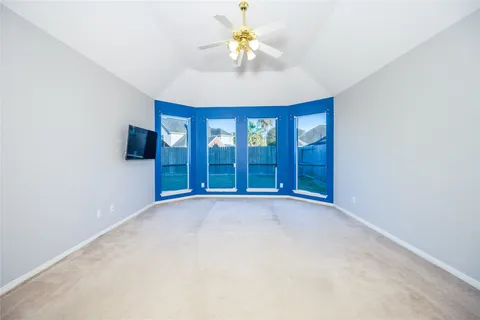 a spacious bathroom with a tub sink and mirror