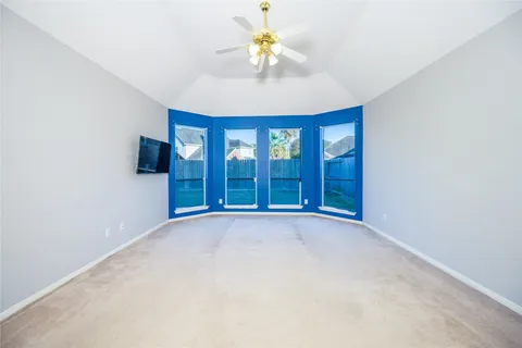 a spacious bathroom with a tub sink and mirror