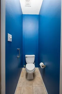 a bathroom with a toilet and a sink