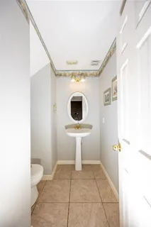 a view of a building stairs and a ceiling fan