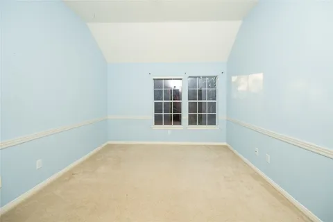 a bathroom with a granite countertop sink a toilet and a bathtub