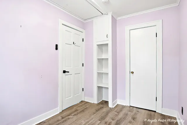 a view of a bathroom with wooden floor