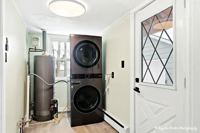 a view of a storage and utility room with washer and dryer