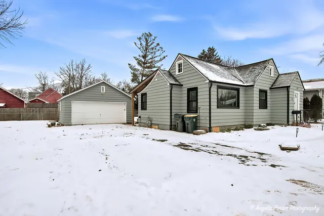 a view of a house with snow on the road