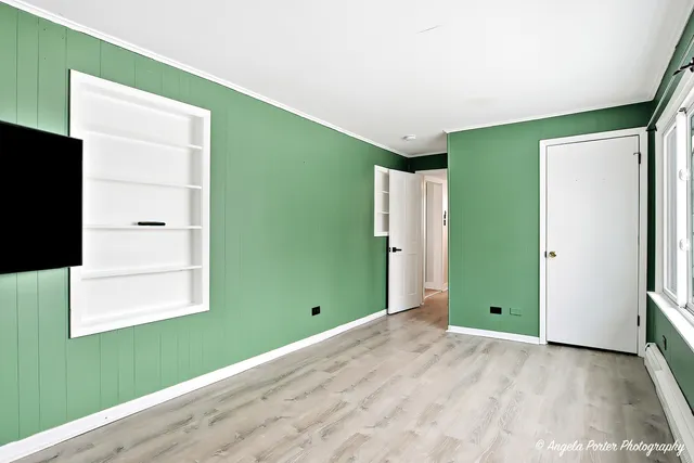 a view of a room that has a large window and dryer