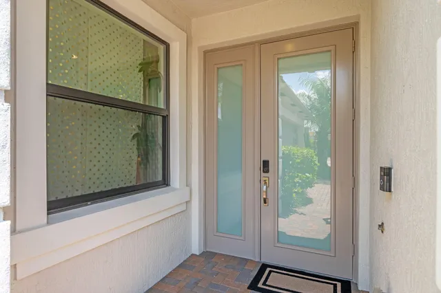 a view of a lake with a garden and a barbeque